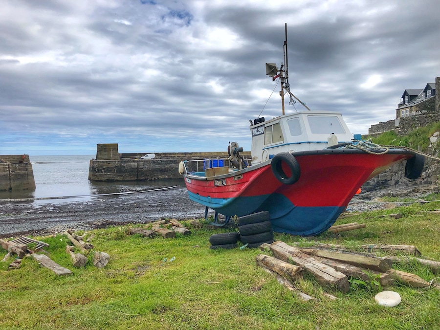 A very small fishing village on the Northumberland coast and the starting point for many people to walk to Dunstanburgh Castle,  
The village surrounds the small harbour where they are known for their kippers