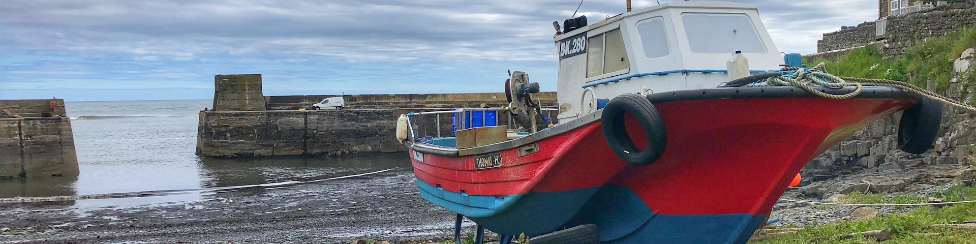 A very small fishing village on the Northumberland coast and the starting point for many people to walk to Dunstanburgh Castle,  
The village surrounds the small harbour where they are known for their kippers