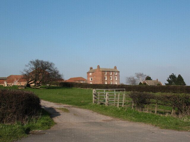 Gringley Grange near Gringley on the Hill A big red-brick farmhouse on the crest of a hill. The style looks late 18th century.