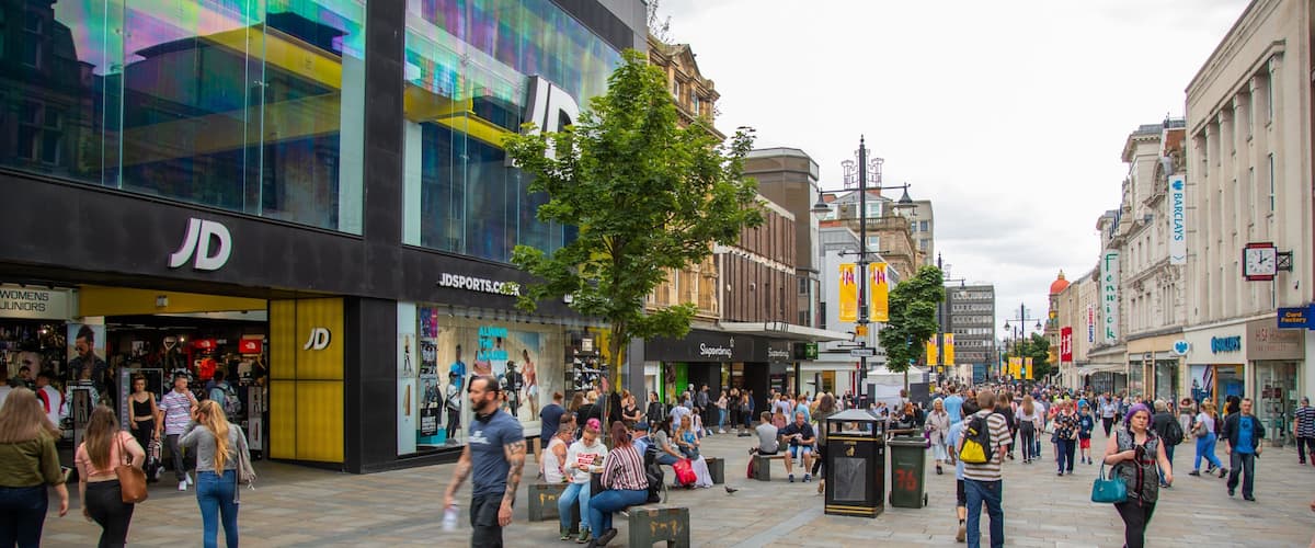 Northumberland Street featuring street scenes as well as a large group of people