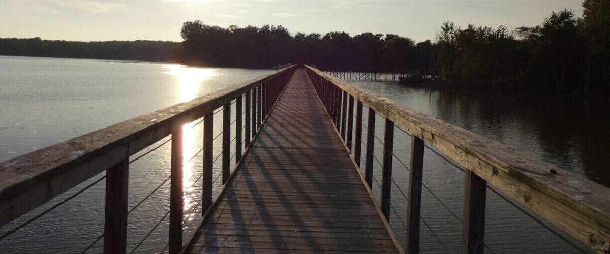 A sunset view of the boardwalk jutting out into the Hoover Reservoir. The water level at this end of the reservoir is lowered in the fall so it’s more hospitable to migrating shore birds.