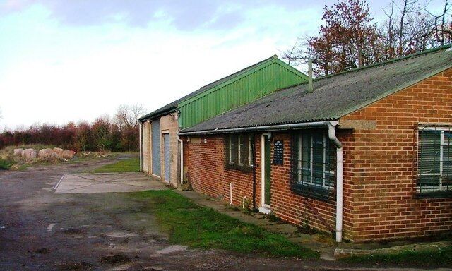 Former Tramway Terminus, Langbaurgh Quarry This site, adjacent to the Middlesbrough to Whitby railway, was the terminus of a tramway from the whinstone quarries at Langbaurgh Ridge (between NZ554122 and NZ562120). The sidings were still in use to serve the eastern end in 1928, the western end having been abandoned earlier. I am not sure if all the buildings shown are contemporary with the railway sidings or related to the site's later use as a council depot for the storage of road salt. Now the site seems to have been abandoned although I have seen it used as a base for the Cleveland Search and Rescue Team during their exercises.