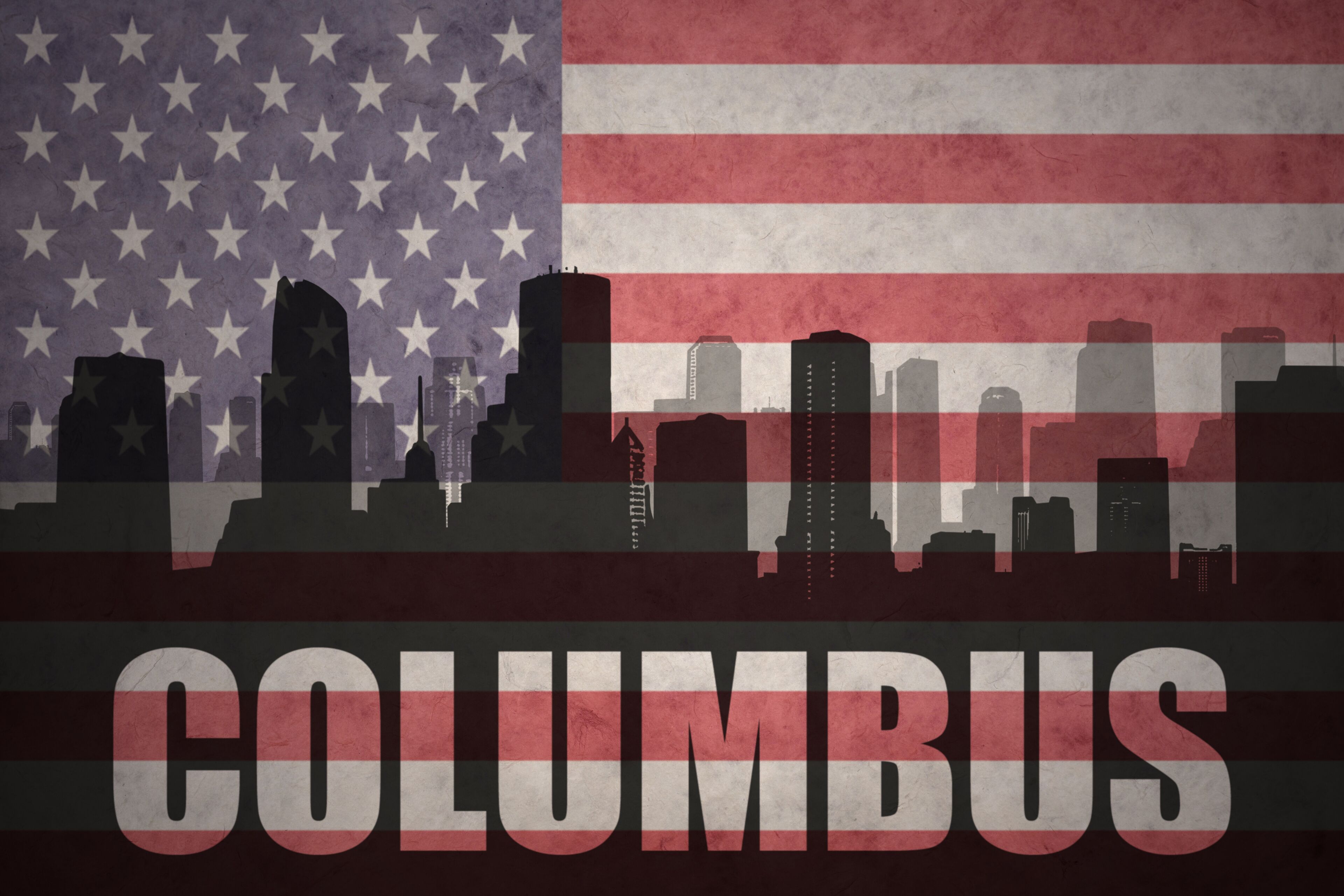 abstract silhouette of the city with text Columbus at the vintage american flag