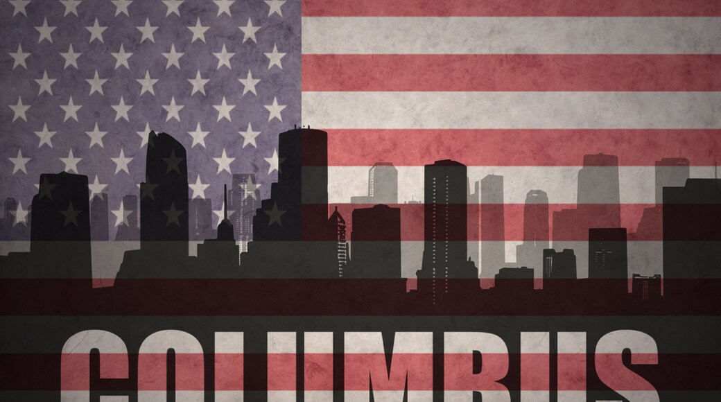 abstract silhouette of the city with text Columbus at the vintage american flag