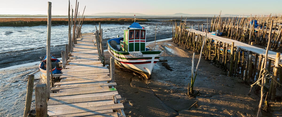 Carrasqueira Palafitic Pier in Comporta, Portugal with fishing boats