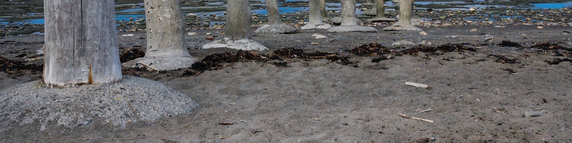 stonework statues leading into the St. Laurence River