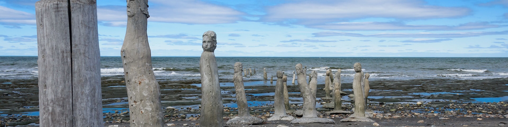 stonework statues leading into the St. Laurence River