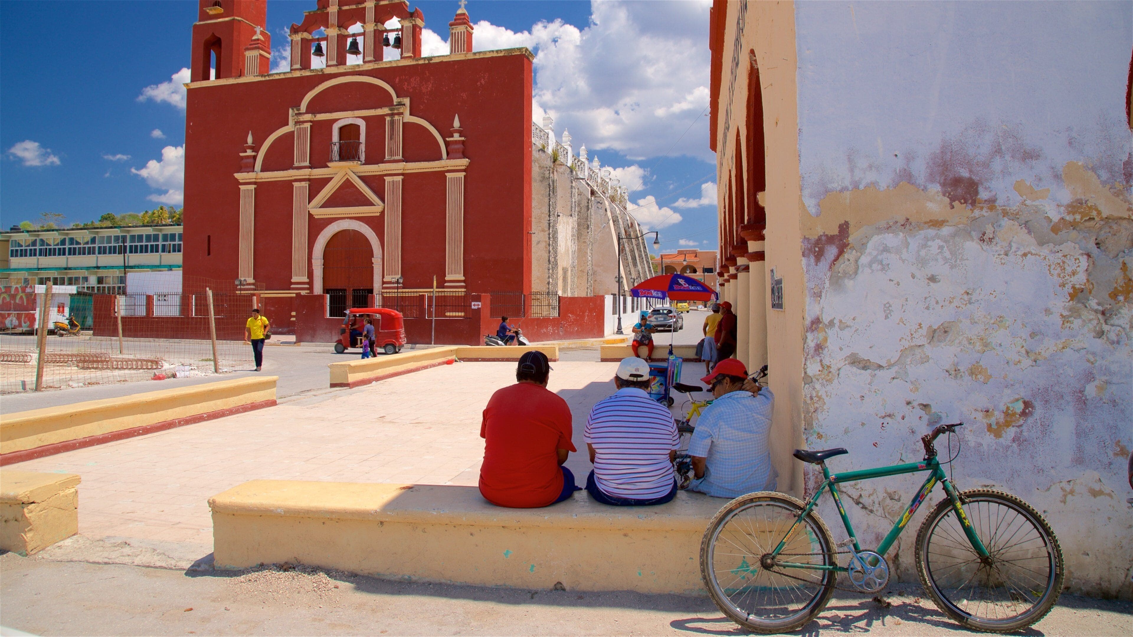 Seybaplaya featuring a church or cathedral as well as a small group of people