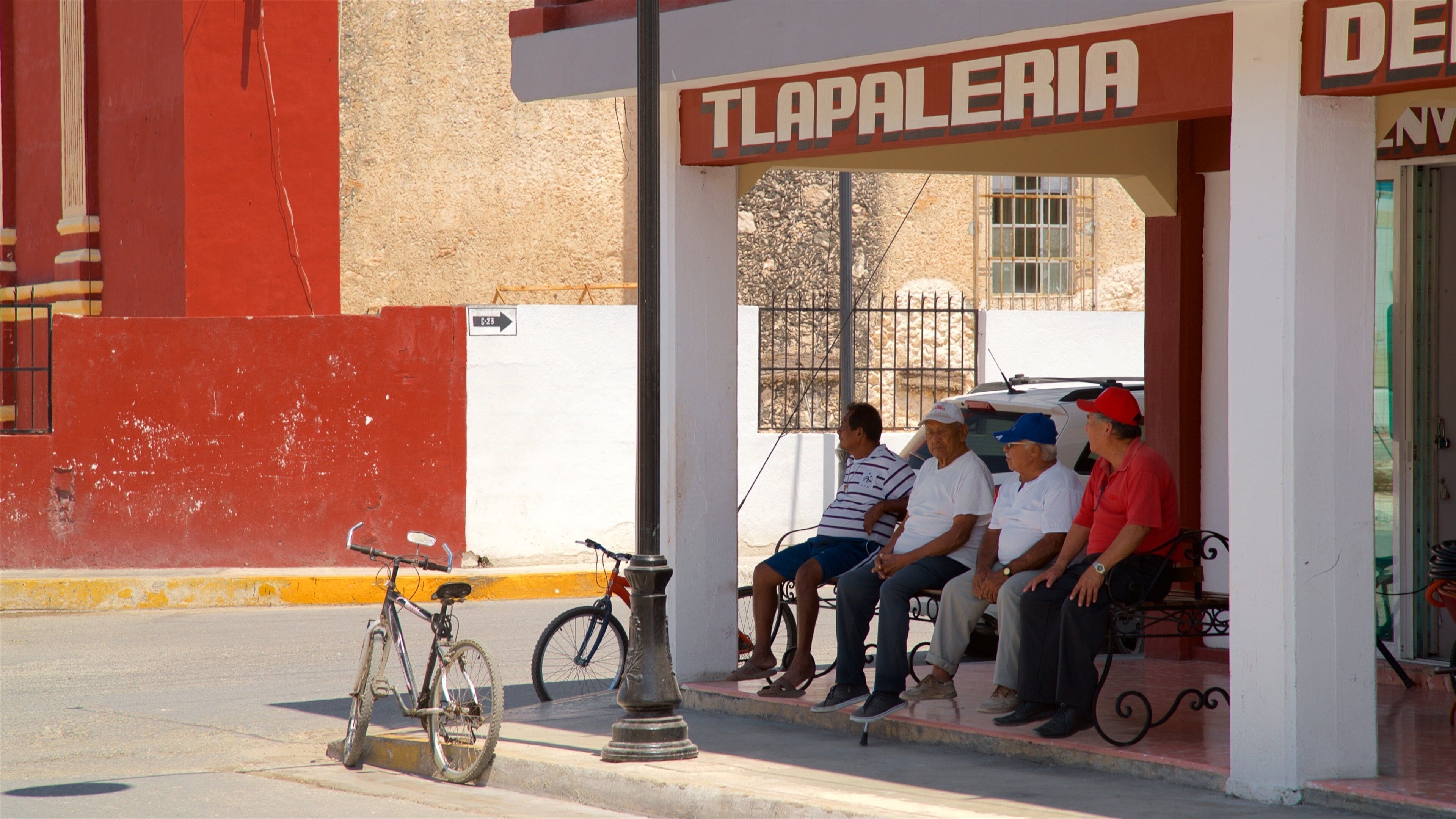 Seybaplaya featuring signage as well as a small group of people