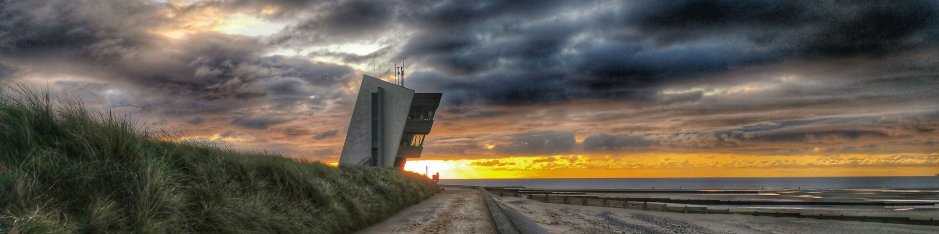 Veiw of Rossall point at sunset with the observation tower in the distance