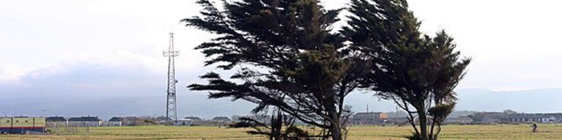 Jurby Industrial Estate. A bleak mixture of unsympathetic housing, industrial units and windswept waste ground characterises this potentially-beautiful area.