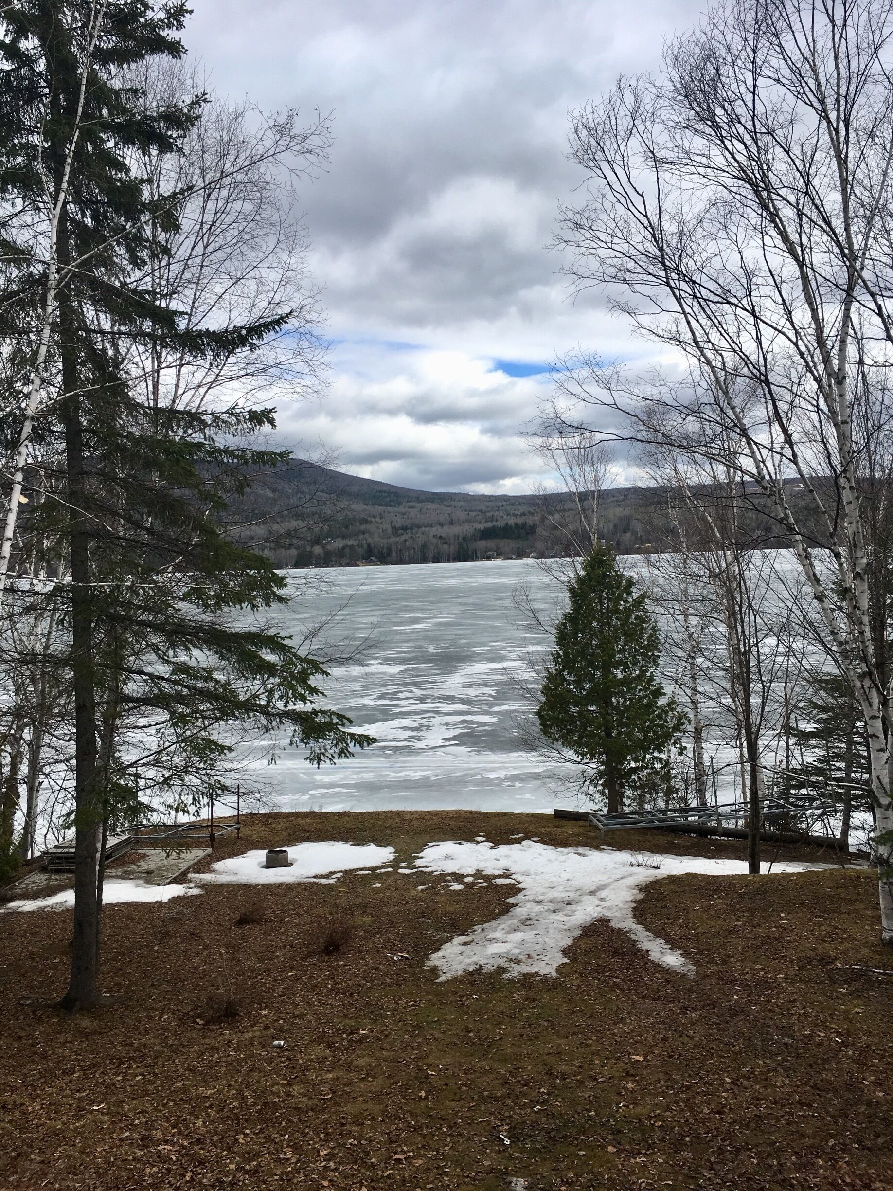 Pohénégamook lake. There is still ice on it even at the beginning of May. 

Pohénégamook is a small town at the border of Québec with New Brunswick, but also at the border of Canada with USA. 