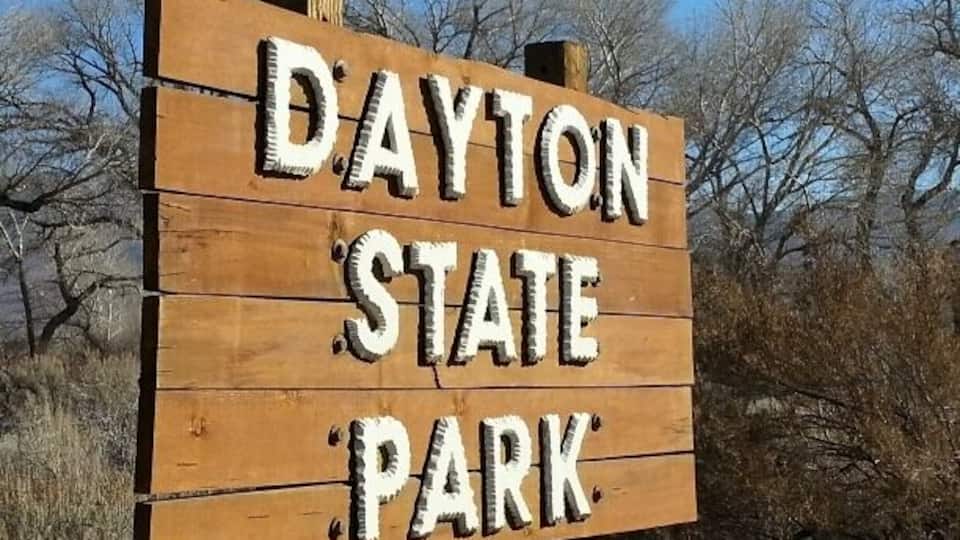 A wooden sign with the text "Dayton State Park".