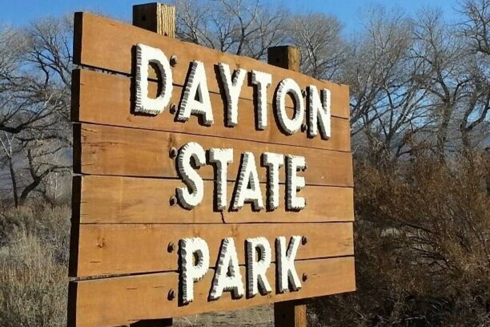 A wooden sign with the text "Dayton State Park".