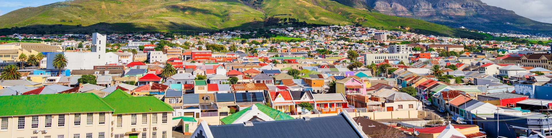 Cloud-covered Table Mountain and Devil's Peak over Woodstock houses, Cape Town, South Africa