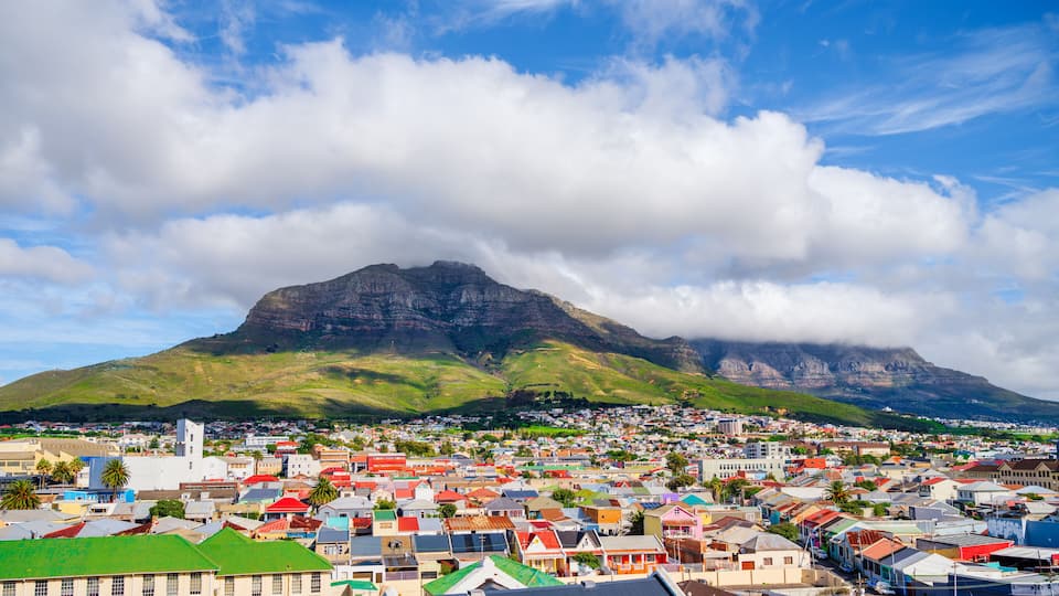 Cloud-covered Table Mountain and Devil's Peak over Woodstock houses, Cape Town, South Africa