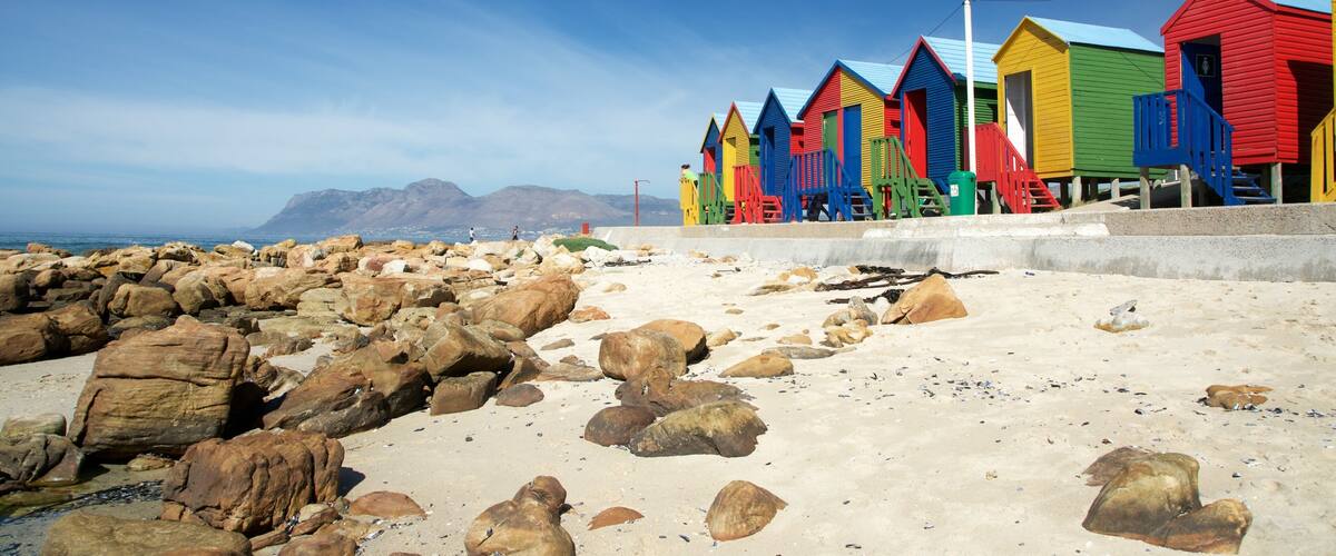 Cape Town which includes rocky coastline, a coastal town and a sandy beach