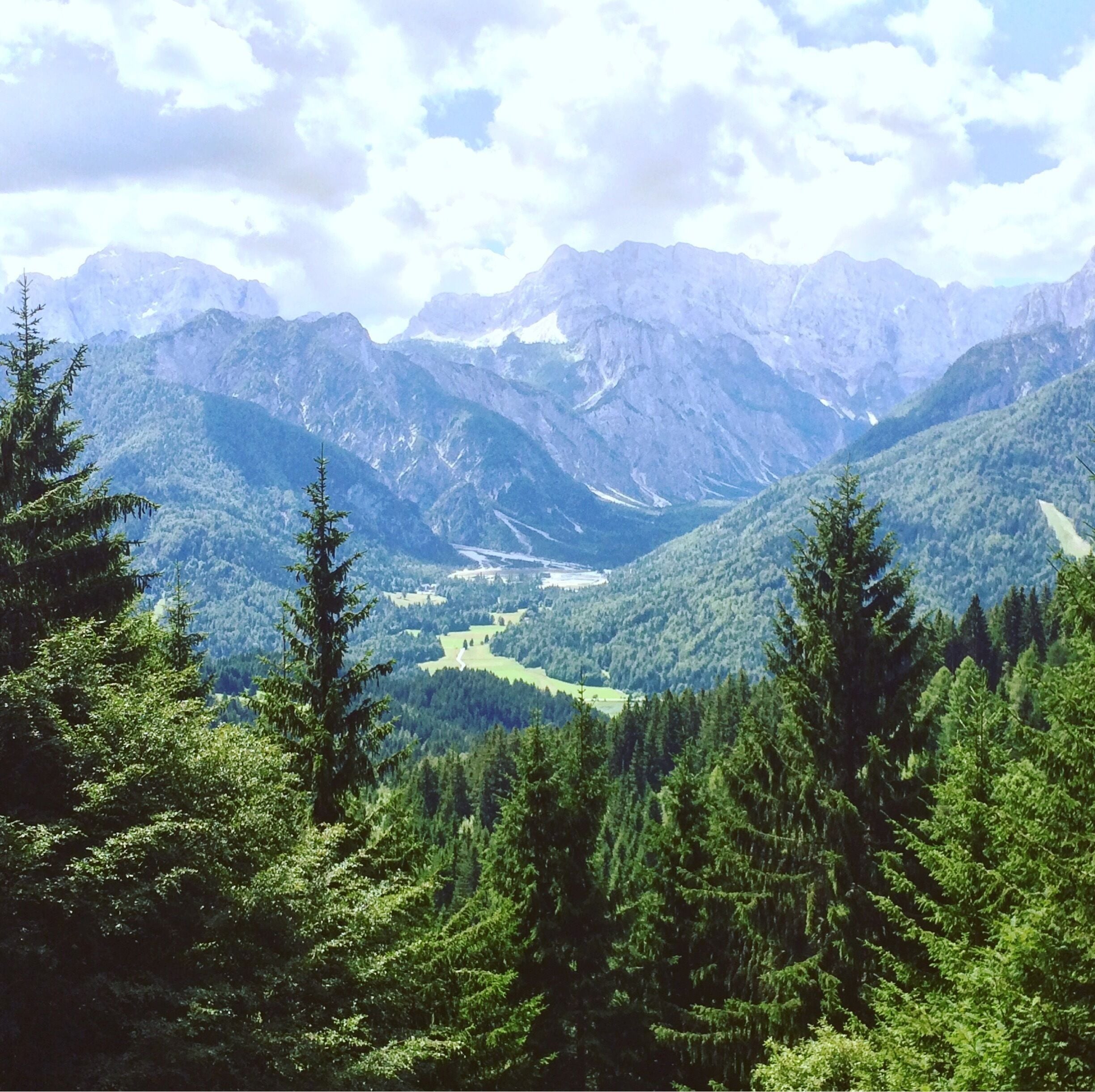 The trail goes to the top of the mountain where the borders between Austria, Italy and Slovenia meet. It starts in the small slovenian village called Rateče. The picture shows the Vršič Pass on the opposite side of the valley. 