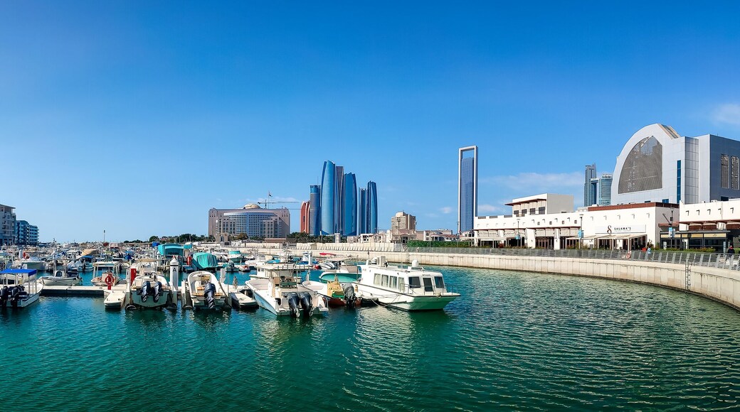 Al Marasy Marina with luxury yachts and Abu Dhabi downtown area view