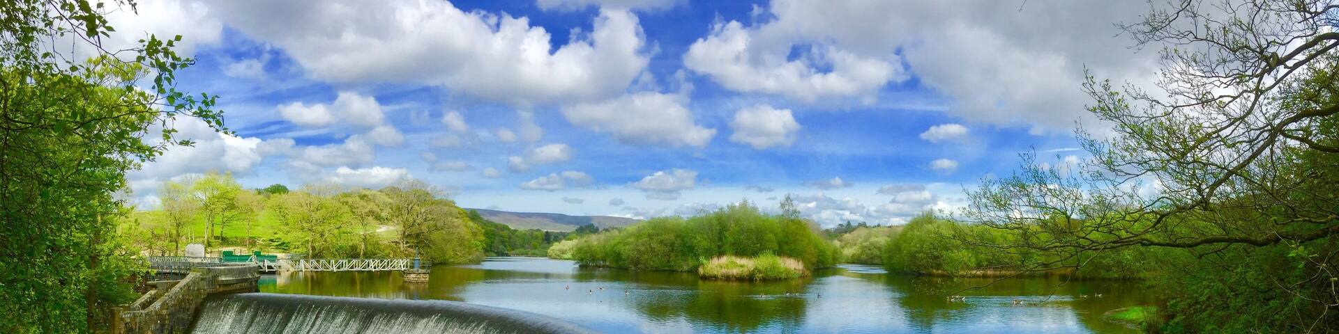 The River Wyre at Abbeystead. Park at Stoops Bridge to walk through woodland and around the reservoir to the dam.