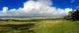 Looking over the Kent estuary towards a rainy Lake District from a sunny Arnside Knott.