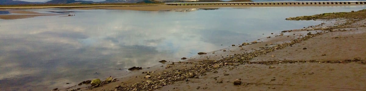The Kent Estuary at Arnside. Watch out for quicksand and fast incoming tides here. Canoeists wait for the changing tide to surf the bore tide wave.