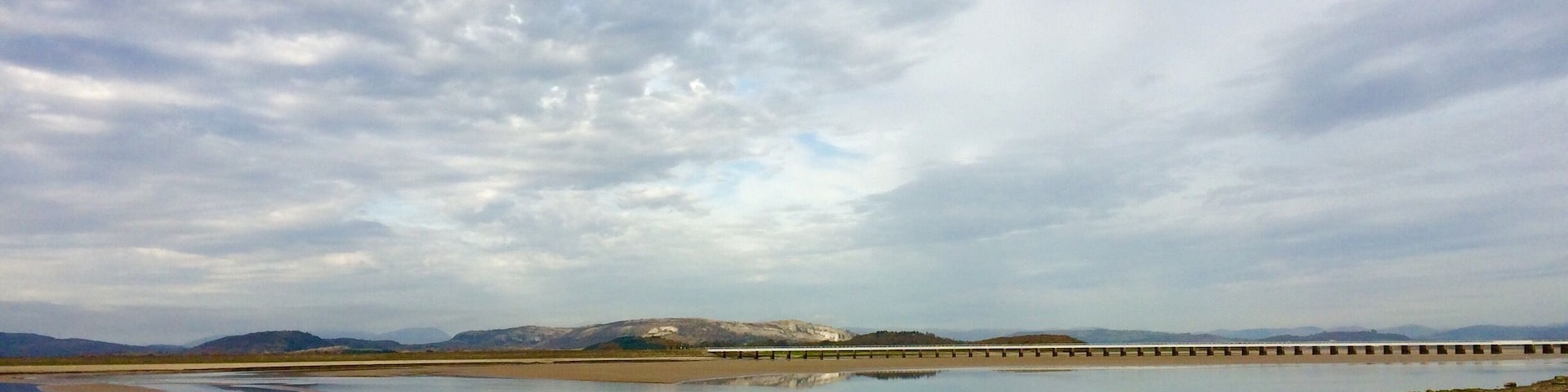 The Kent Estuary at Arnside. Watch out for quicksand and fast incoming tides here. Canoeists wait for the changing tide to surf the bore tide wave.