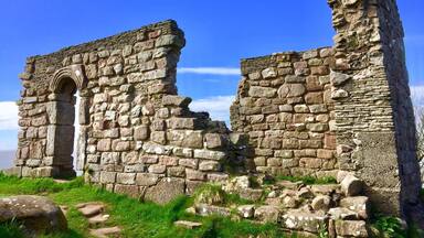 Ancient stone ruins with a clear sky.