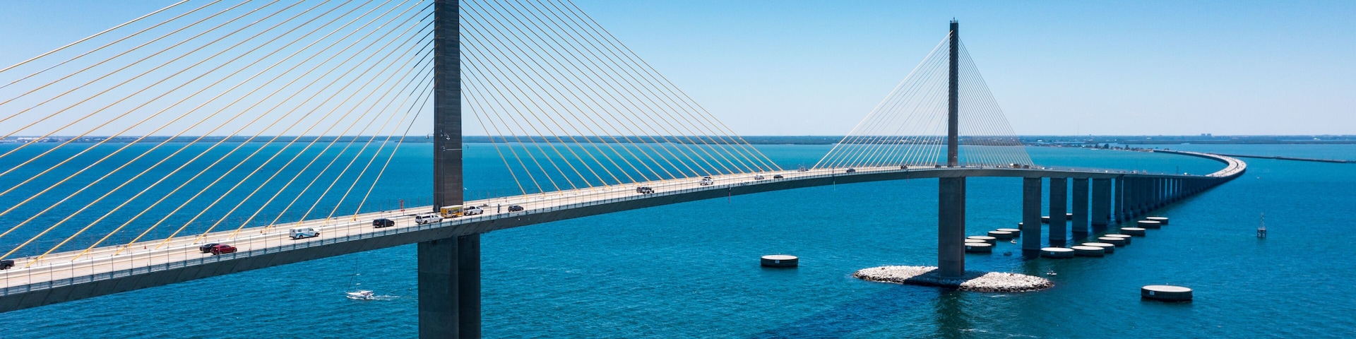 Sunshine Skyway Bridge in Tampa Bay Florida. Large Suspension Bridge that ships pass underneath. Florida gulf coast fishing pier.
