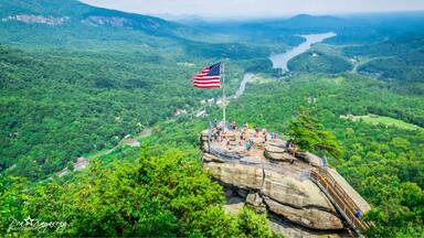 Top of the Rock: To reach the top of Chimney Rock, drive up a three mile winding road to a large parking area. Then ride the 26-story elevator to the top (in just 30 seconds) or climb 500 steps to the chimney. On a clear day, enjoy 75-mile views overlooking Lake Lure and the Hickory Nut Gorge.