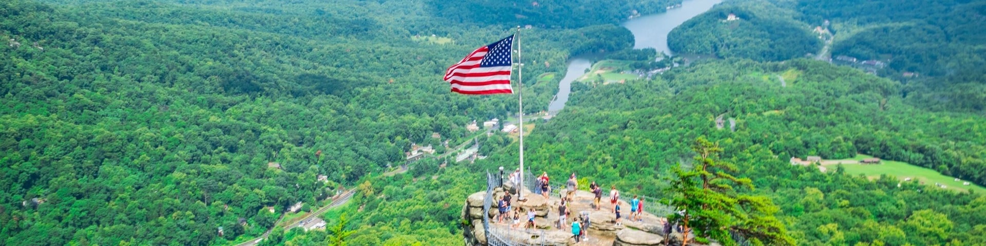 Top of the Rock: To reach the top of Chimney Rock, drive up a three mile winding road to a large parking area. Then ride the 26-story elevator to the top (in just 30 seconds) or climb 500 steps to the chimney. On a clear day, enjoy 75-mile views overlooking Lake Lure and the Hickory Nut Gorge.