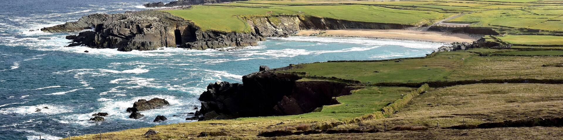 Clogher Head Car Park , Dingle Peninsula , Ireland
The view of Clogher Strand Beach and Three Sisters (group of three peaks) from Clogher Head Car Park.