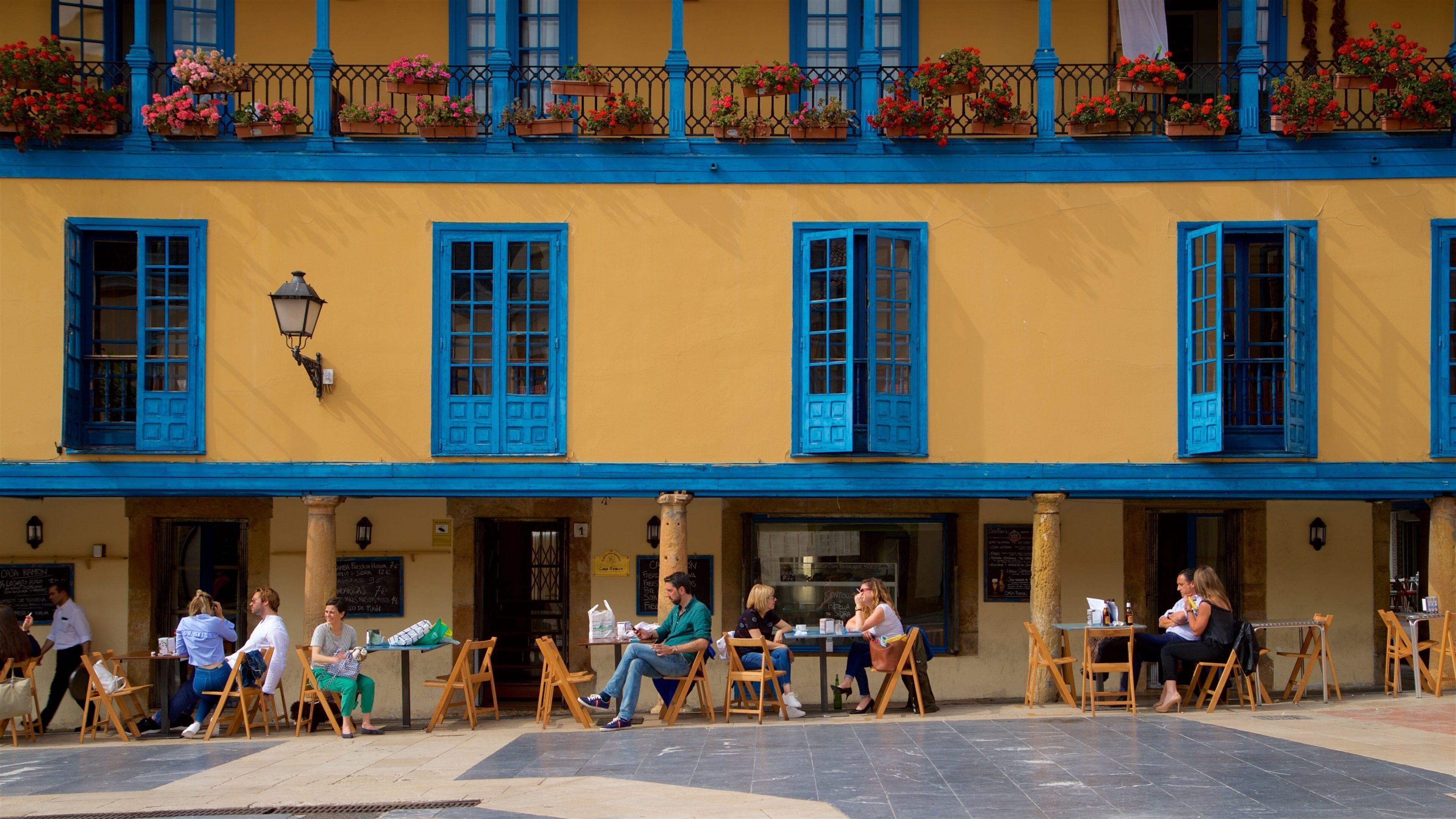 Old Town which includes outdoor eating as well as a small group of people
