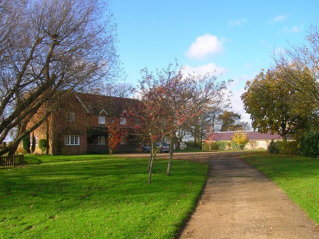 A brick house with a garden path leading to it.