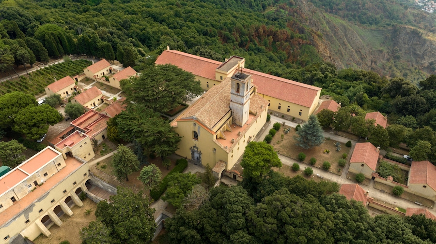 Aerial view of the Camaldoli Hermitage in Naples, Italy. It is an ancient religious complex with a Catholic church and located on top of a mountain.