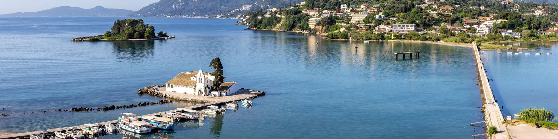 Vlacherna monastery and Mouse Island at Mediterranean sea panorama from above on Corfu island in Greece