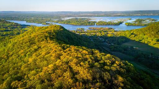 Aerial view from Apple Blossom Overlook Park showing green rolling hills and the Mississippi River