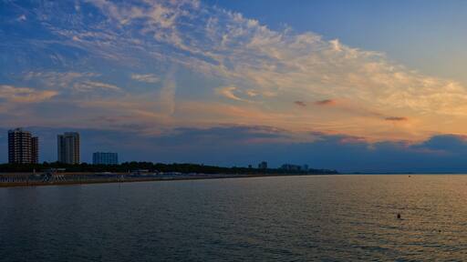 Amazing Sunset on the Sea. Adriatic sea, beautiful sunset, waves and landscape. Lignano Sabbiadoro, Italy.