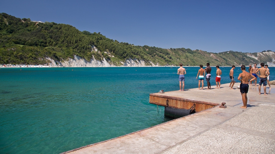 Portonovo featuring general coastal views as well as a small group of people