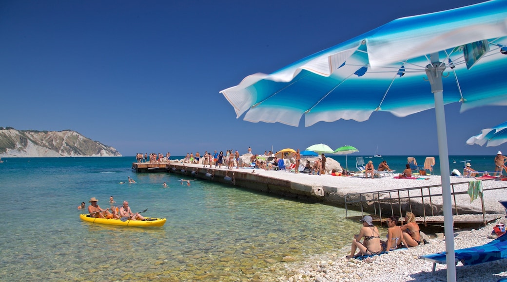 Portonovo showing kayaking or canoeing, general coastal views and a pebble beach