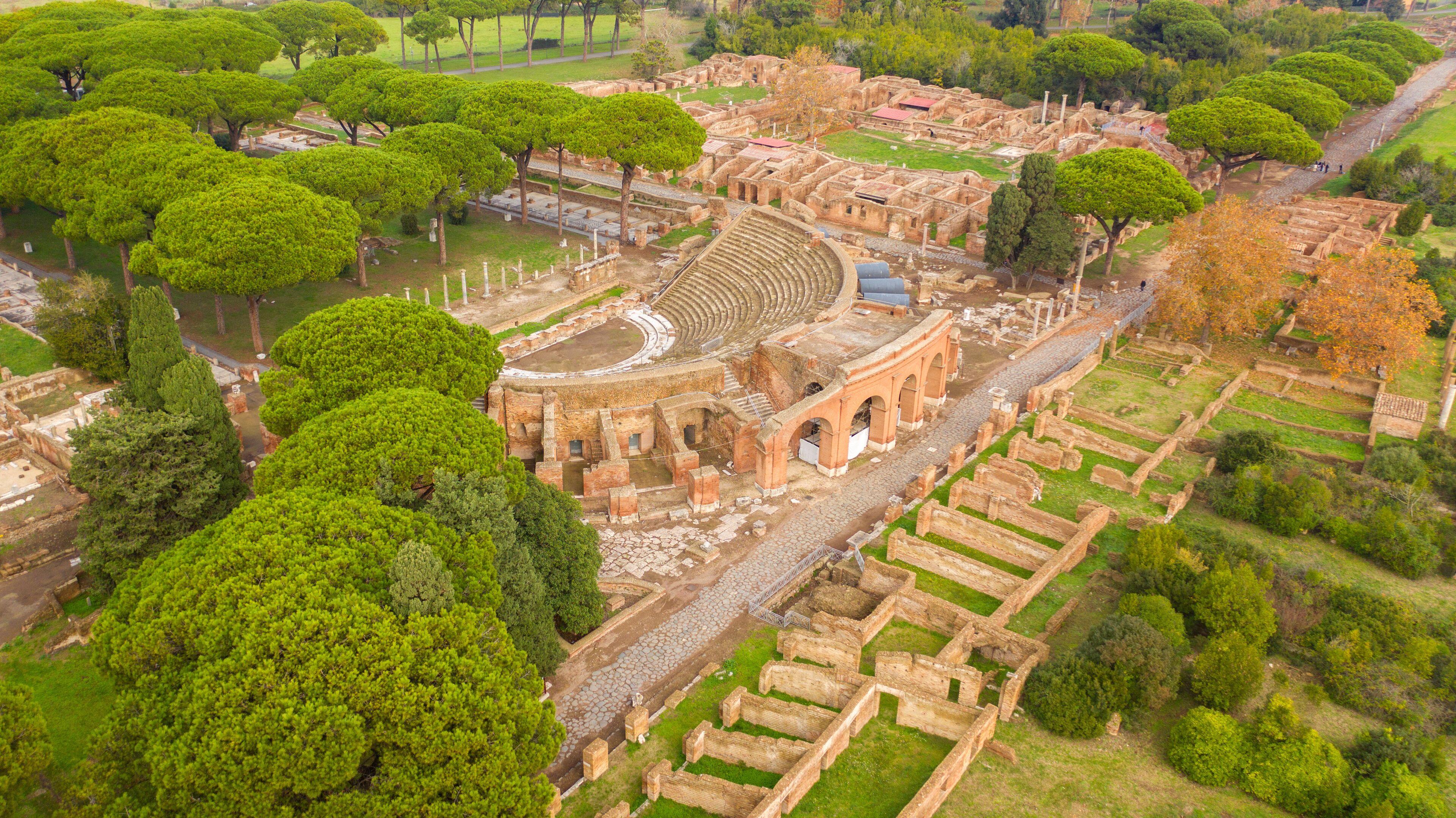 Aerial view on the Excavations road and the Roman theatre of Ostia Antica, a large archaeological site. These Roman ruins are located in the archaeological area of Ostia Antica, near Rome, Italy.
