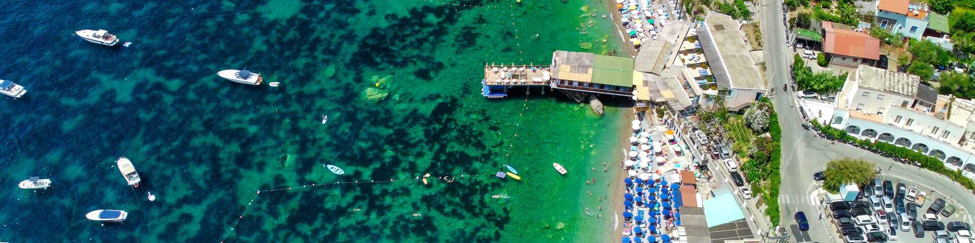 Aerial drone view of Marina del Cantone beach and coastline on Amalfi Coast