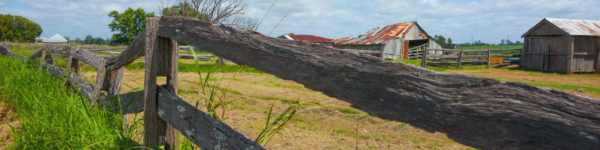 Old weathered post and rail fence leading away along highway Rural scenes between Ulmarra and Yamba.
