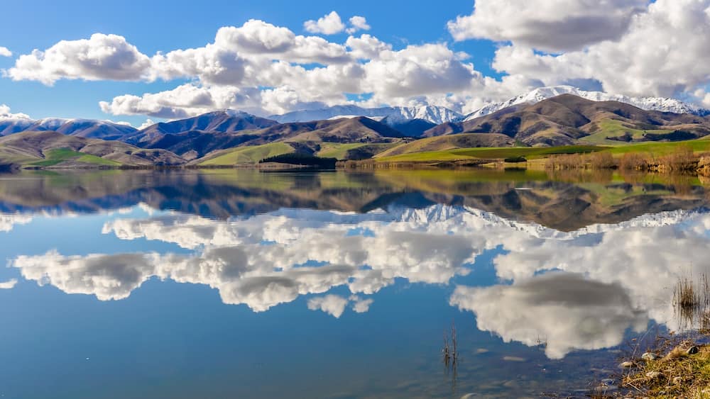 Reflection of snowy mountains near Fairlie, New Zealand