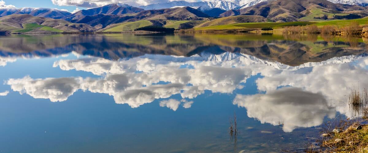 Reflection of snowy mountains near Fairlie, New Zealand