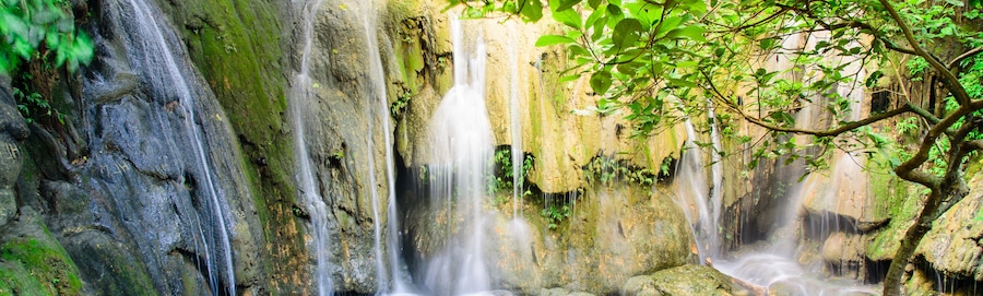 Panoramic mature trees and milky falls at Thac Voi waterfall, Thanh Hoa, Vietnam