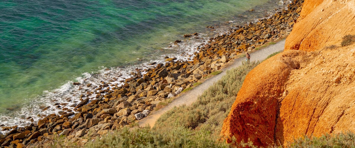 Christies Beach which includes rugged coastline and general coastal views