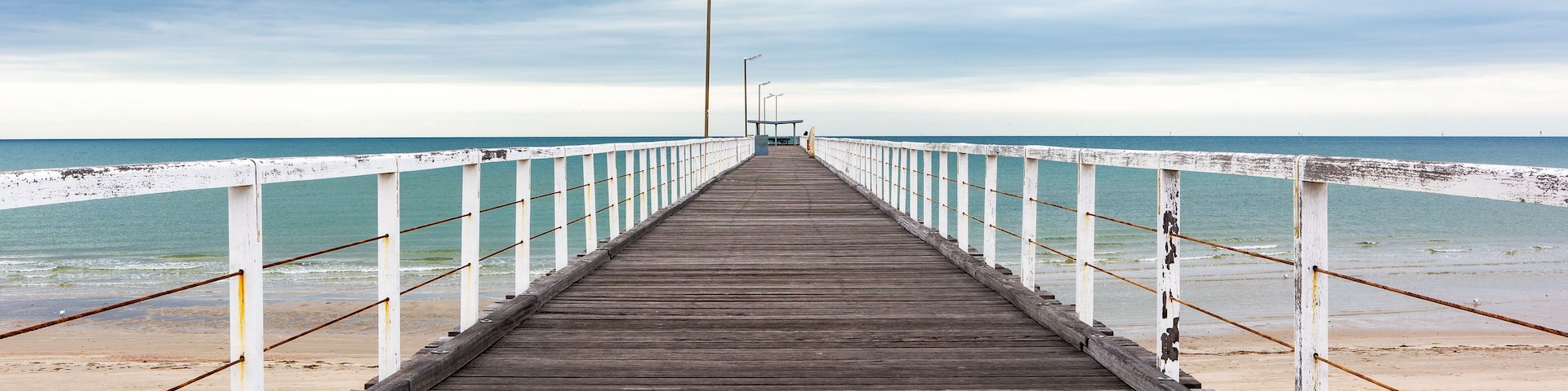The old largs bay jetty on an overcast day with no people in adelaide south australia on october 26th 2020