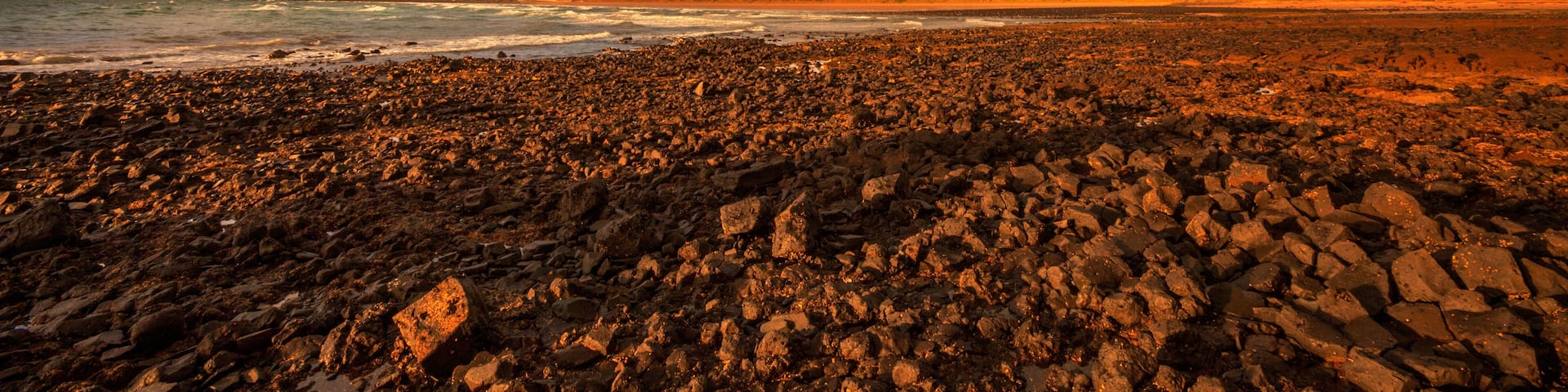 Scenic ,rainbow ,over Ogilvey Beach, Stanley. The Nut a volcanic plug in the distance. North West Coast of Tasmania, Australia.