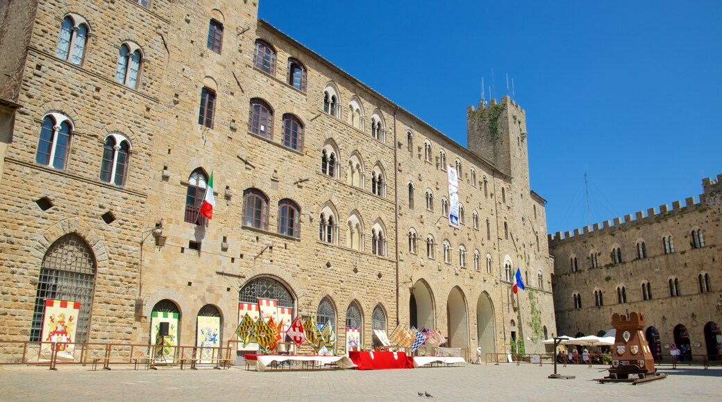 Piazza dei Priori which includes a city, outdoor art and heritage architecture